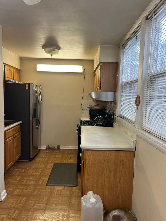 2039 Pine St Unit C, Des Plaines, IL 60018 - kitchen with gas stove, stainless steel fridge with ice dispenser, plenty of natural light, and brown cabinetry