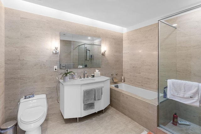 401 N Wabash Ave Unit 42E, Chicago, IL 60611 - bathroom with tile walls, tiled tub, vanity, toilet, and a shower