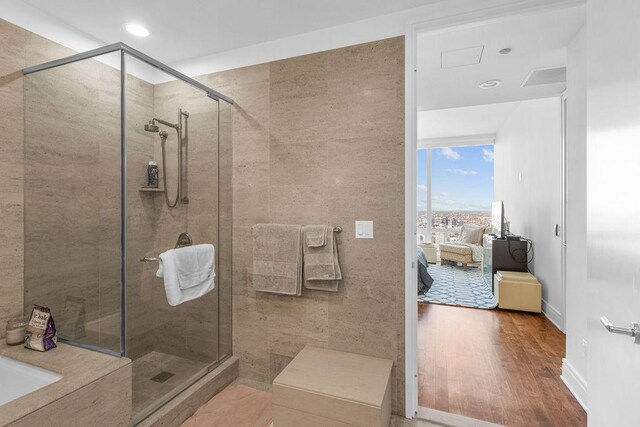 401 N Wabash Ave Unit 42E, Chicago, IL 60611 - full bath featuring a shower stall, wood finished floors, a tub, and recessed lighting