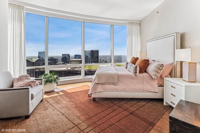 401 N Wabash Ave Unit 54E, Chicago, IL 60611 - bedroom with wood finished floors, a city view, and floor to ceiling windows
