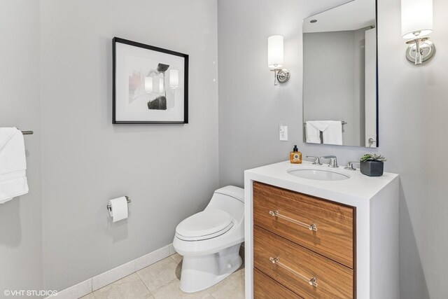 401 N Wabash Ave Unit 54E, Chicago, IL 60611 - bathroom featuring toilet, tile patterned flooring, vanity, and baseboards
