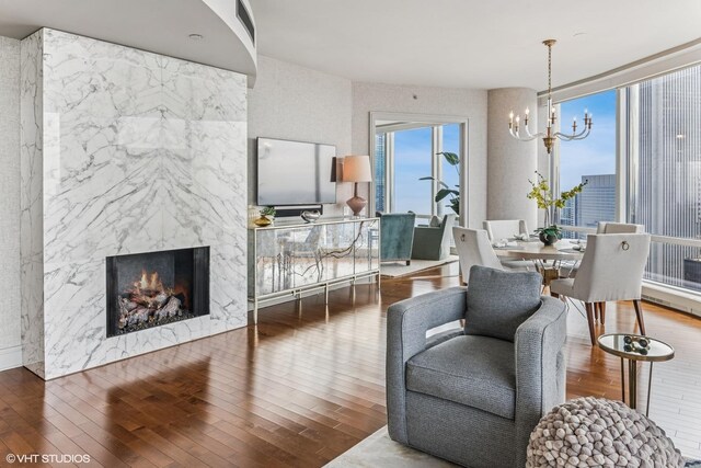 401 N Wabash Ave Unit 54E, Chicago, IL 60611 - living area with a chandelier, wood finished floors, and a fireplace