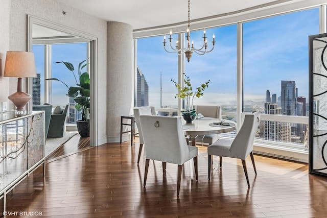 401 N Wabash Ave Unit 54E, Chicago, IL 60611 - dining area with a chandelier, hardwood / wood-style floors, a view of skyline, and a wall of windows