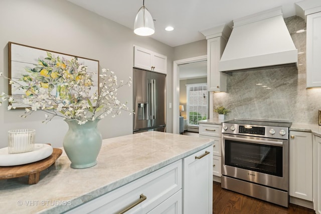 614 S Patton Ave, Arlington Heights, IL 60005 - kitchen with stainless steel appliances, custom exhaust hood, tasteful backsplash, white cabinets, and hanging light fixtures