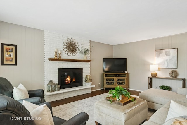 614 S Patton Ave, Arlington Heights, IL 60005 - living area featuring wood finished floors, a fireplace, and baseboards