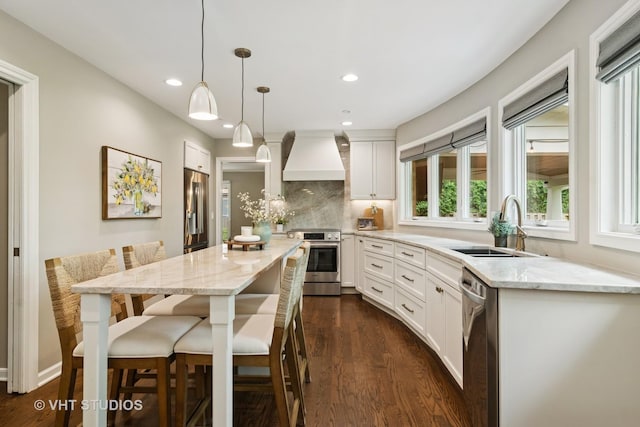 614 S Patton Ave, Arlington Heights, IL 60005 - kitchen featuring appliances with stainless steel finishes, premium range hood, a sink, dark wood-type flooring, and recessed lighting