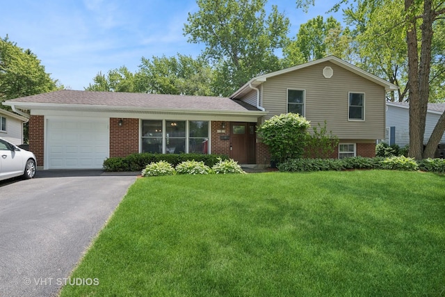 150 Red Bridge Rd, Lake Zurich, IL 60047 - tri-level home featuring a garage, asphalt driveway, a front yard, and brick siding