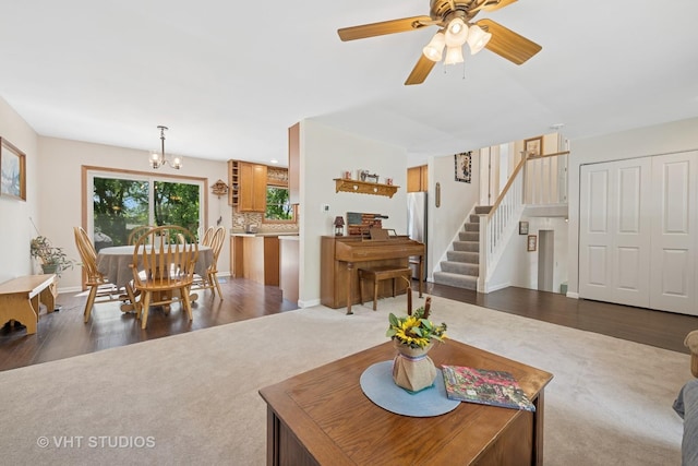 150 Red Bridge Rd, Lake Zurich, IL 60047 - living area featuring stairway, dark colored carpet, baseboards, a chandelier, and a ceiling fan