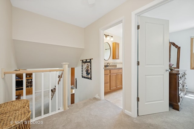150 Red Bridge Rd, Lake Zurich, IL 60047 - hall featuring an upstairs landing, light colored carpet, a sink, and baseboards
