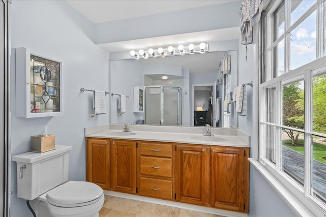 1025 Oxford Rd, Deerfield, IL 60015 - bathroom featuring a stall shower, double vanity, and toilet