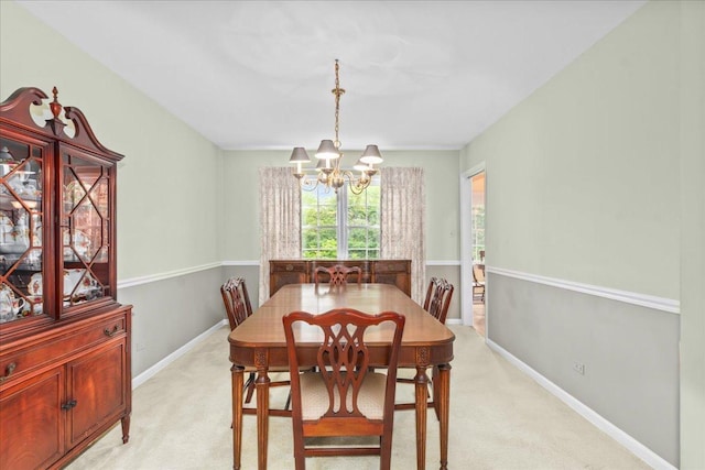 1025 Oxford Rd, Deerfield, IL 60015 - dining area featuring a chandelier, light carpet, and baseboards