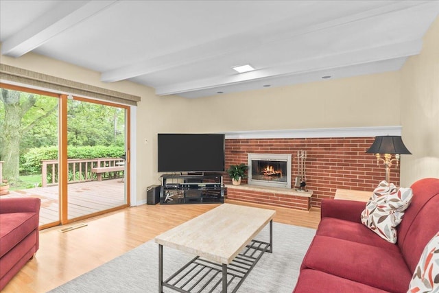 1025 Oxford Rd, Deerfield, IL 60015 - living area with beam ceiling, wood finished floors, and a brick fireplace