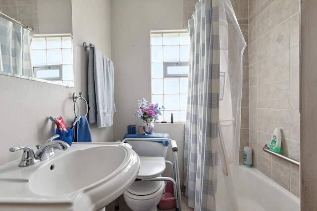 18122 Wentworth Ave, Lansing, IL 60438 - bathroom with a sink, shower / bath combo with shower curtain, and toilet