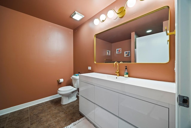 320 E 21st St Unit 402, Chicago, IL 60616 - bathroom with toilet, vanity, baseboards, and tile patterned flooring