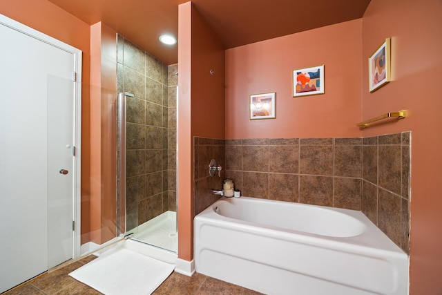 320 E 21st St Unit 402, Chicago, IL 60616 - bathroom featuring a bath, a shower stall, recessed lighting, and tile patterned floors