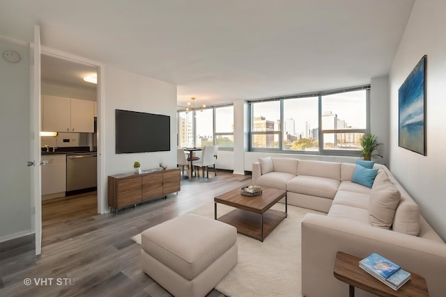 1700 E 56th St Unit 904, Chicago, IL 60637 - living room with light wood-style flooring and a chandelier