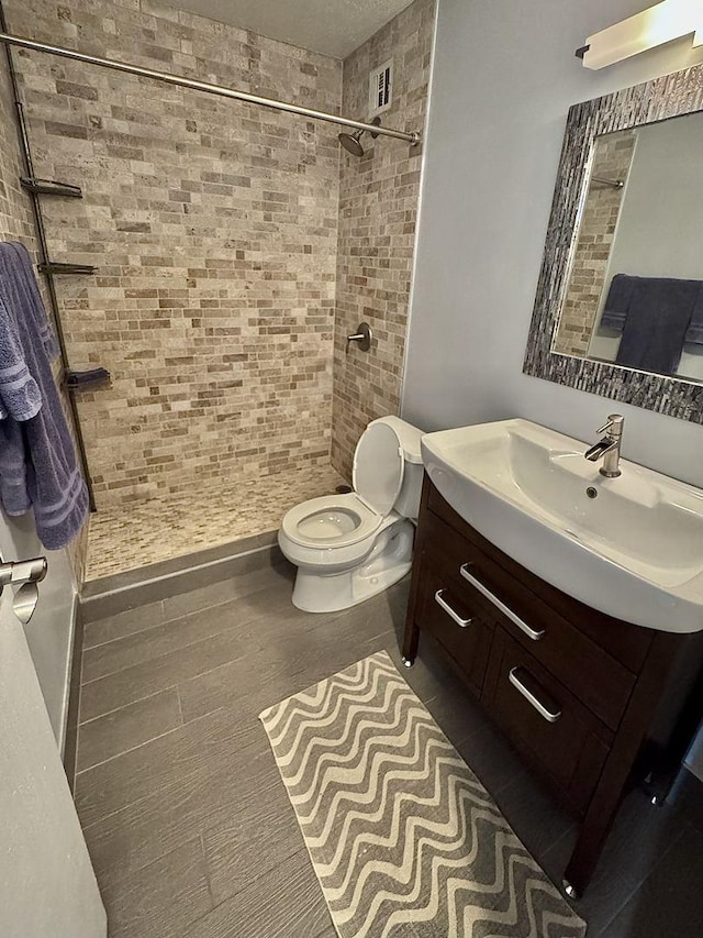 2740 N Pine Grove Ave Unit 9B, Chicago, IL 60614 - full bath featuring toilet, vanity, and tiled shower