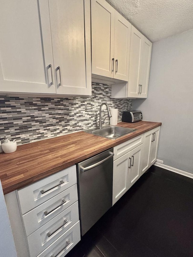 2740 N Pine Grove Ave Unit 9B, Chicago, IL 60614 - kitchen with wooden counters, stainless steel dishwasher, backsplash, white cabinets, and a textured ceiling