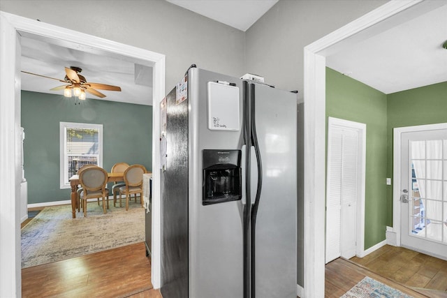 509 S Main St, Homer, IL 61849 - kitchen with stainless steel refrigerator with ice dispenser, wood finished floors, a ceiling fan, and baseboards