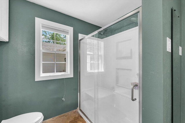 509 S Main St, Homer, IL 61849 - bathroom with a shower stall, toilet, and baseboards