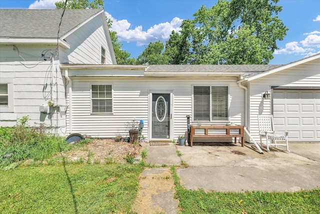 509 S Main St, Homer, IL 61849 - view of front facade with a shingled roof and a garage