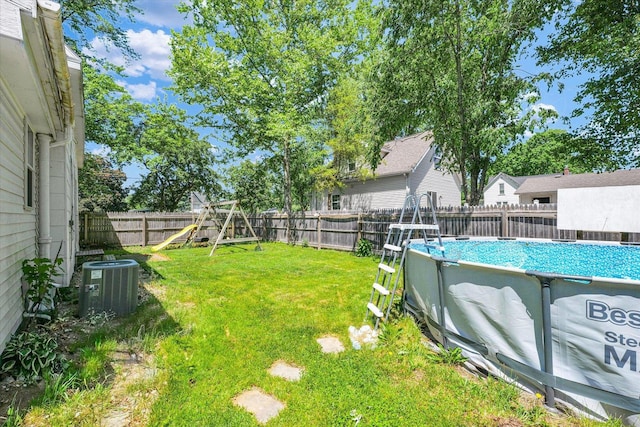 509 S Main St, Homer, IL 61849 - view of yard featuring a playground and cooling unit