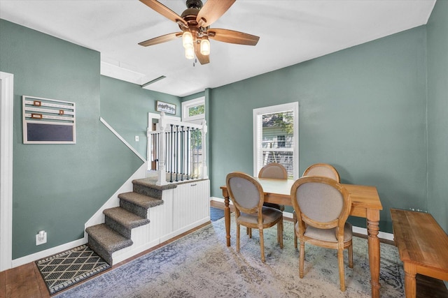 509 S Main St, Homer, IL 61849 - dining area featuring a ceiling fan, baseboards, stairway, and wood finished floors