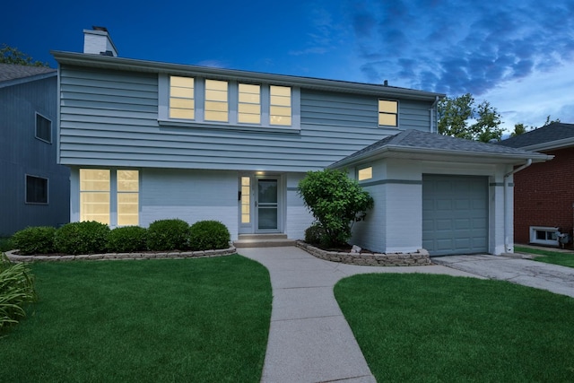 2109 Cummings Ln, Flossmoor, IL 60422 - view of front of home with a garage, a front lawn, a chimney, and driveway