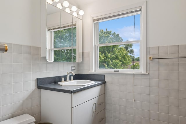 2109 Cummings Ln, Flossmoor, IL 60422 - half bathroom with tile walls, vanity, plenty of natural light, and toilet