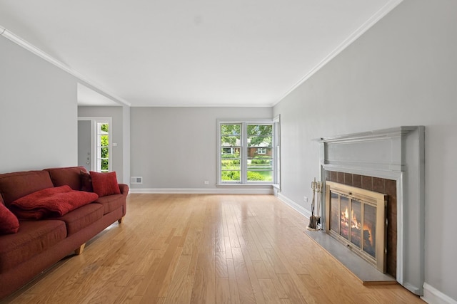 2109 Cummings Ln, Flossmoor, IL 60422 - living room with crown molding, a glass covered fireplace, baseboards, and light wood-type flooring
