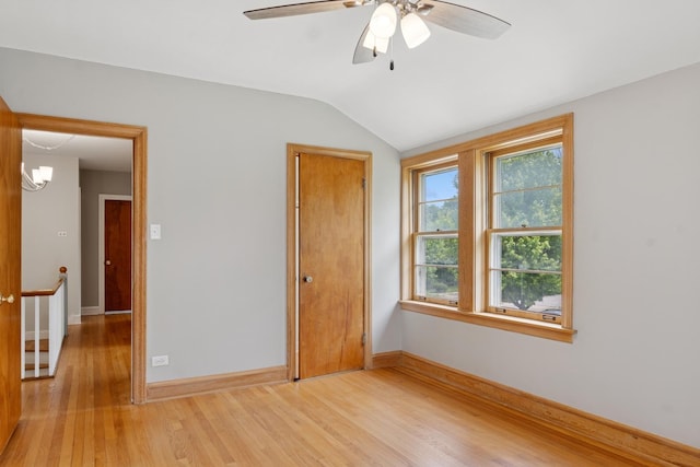 2109 Cummings Ln, Flossmoor, IL 60422 - unfurnished bedroom with light wood finished floors, lofted ceiling, baseboards, a closet, and ceiling fan