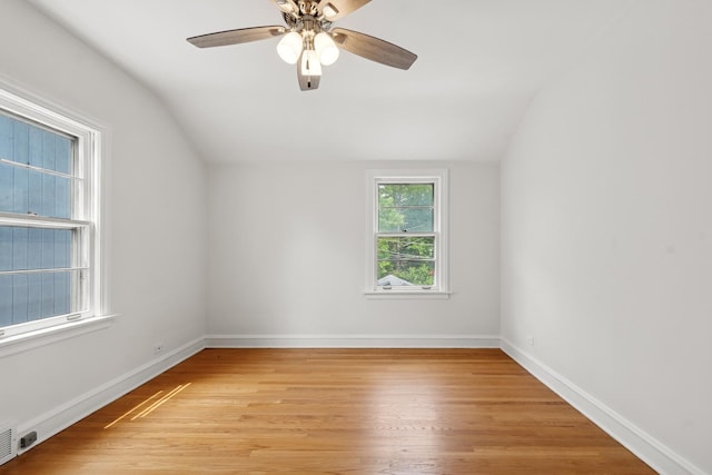 2109 Cummings Ln, Flossmoor, IL 60422 - spare room featuring vaulted ceiling, ceiling fan, light wood finished floors, and baseboards
