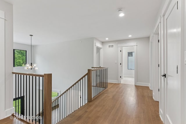 1527 N Louise Ln, Palatine, IL 60067 - hall featuring an upstairs landing, wood finished floors, a chandelier, and recessed lighting