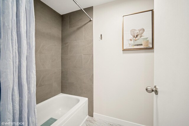 603 Barberry Ln, Wheeling, IL 60090 - bathroom with marble look tile flooring, shower / bath combo, and baseboards