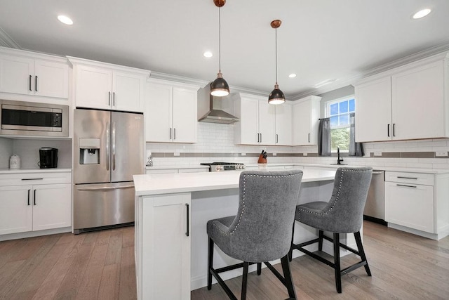 6704 Whisper Glen Dr, Plainfield, IL 60586 - kitchen with stainless steel appliances, wall chimney range hood, backsplash, light wood-style floors, and light countertops