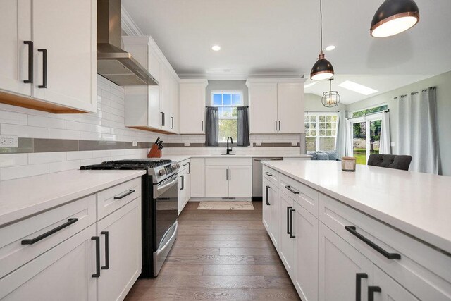 6704 Whisper Glen Dr, Plainfield, IL 60586 - kitchen featuring wall chimney range hood, stainless steel appliances, white cabinets, and recessed lighting