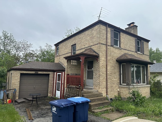 355 S Westgate Rd, Des Plaines, IL 60016 - rear view of property with brick siding, a chimney, and an outdoor structure