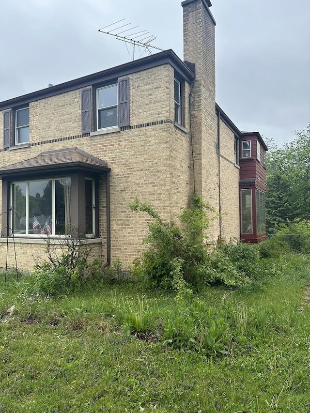 355 S Westgate Rd, Des Plaines, IL 60016 - view of side of property with a chimney and brick siding