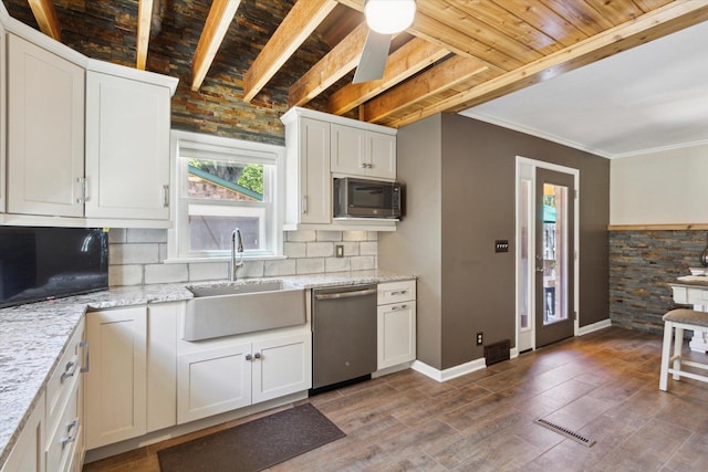 404 Vale Ave N, Rockford, IL 61107 - kitchen with dishwasher, a sink, decorative backsplash, white cabinets, and light stone counters