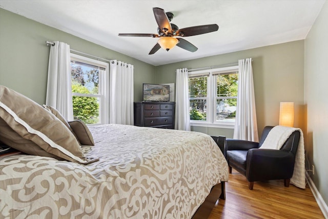 404 Vale Ave N, Rockford, IL 61107 - bedroom featuring wood finished floors, baseboards, and ceiling fan