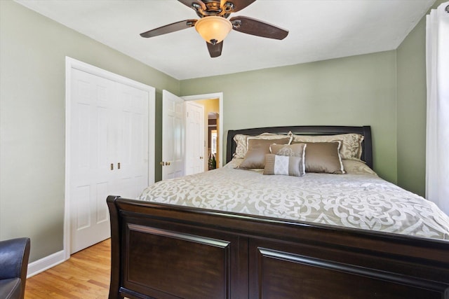 404 Vale Ave N, Rockford, IL 61107 - bedroom with baseboards, light wood-type flooring, a ceiling fan, and a closet