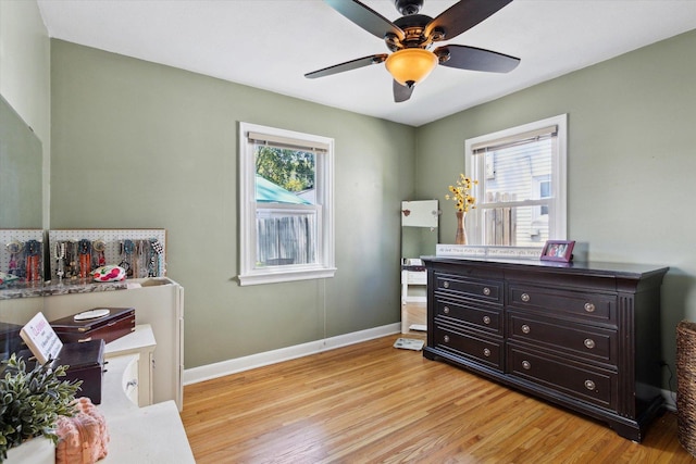 404 Vale Ave N, Rockford, IL 61107 - bedroom featuring multiple windows, light wood-type flooring, baseboards, and a ceiling fan