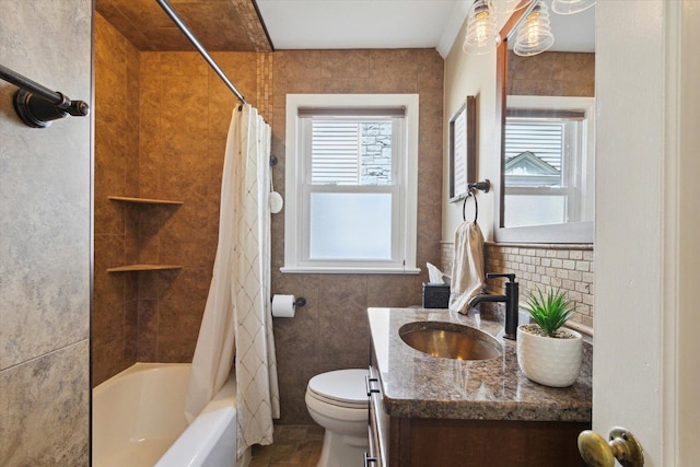404 Vale Ave N, Rockford, IL 61107 - full bathroom featuring toilet, vanity, shower / tub combo with curtain, and tile walls