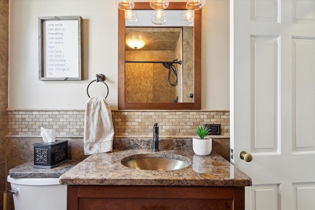 404 Vale Ave N, Rockford, IL 61107 - bathroom featuring vanity, backsplash, toilet, and a shower