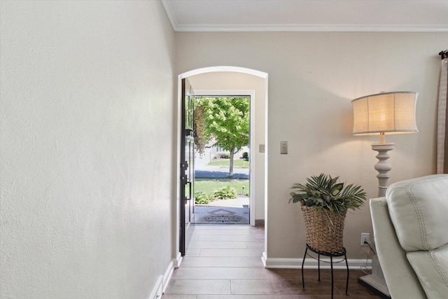404 Vale Ave N, Rockford, IL 61107 - doorway to outside featuring ornamental molding, baseboards, and arched walkways