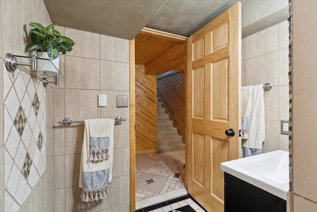 404 Vale Ave N, Rockford, IL 61107 - bathroom with vanity and wood walls