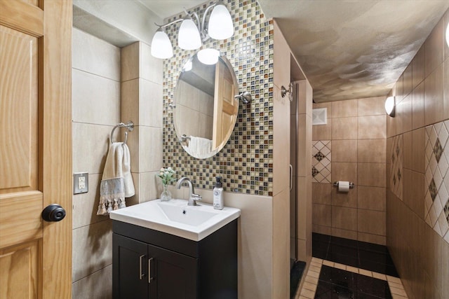 404 Vale Ave N, Rockford, IL 61107 - bathroom featuring tile walls, vanity, and tiled shower