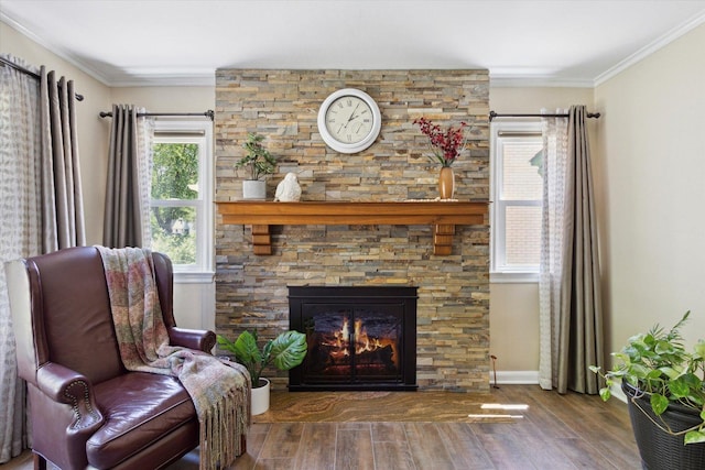 404 Vale Ave N, Rockford, IL 61107 - sitting room featuring wood finished floors, a fireplace, ornamental molding, and baseboards