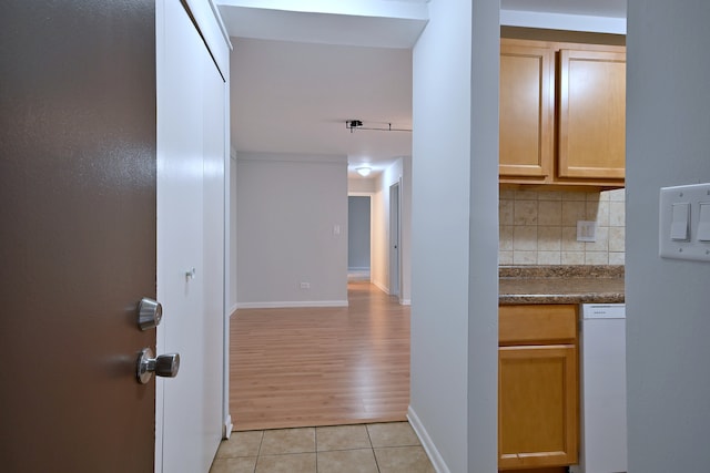 1806 Hemlock Pl Unit 105, Schaumburg, IL 60173 - hall with light tile patterned floors and baseboards