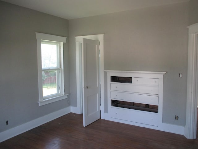 312 Union St, Joliet, IL 60433 - unfurnished bedroom featuring dark wood-type flooring and baseboards